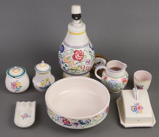A Poole Pottery table lamp decorated birds 25cm, a circular Poole pottery bowl 22cm, ditto butter dish 7cm, jug, 2 preserve jars and covers and a beaker and an ashtray 