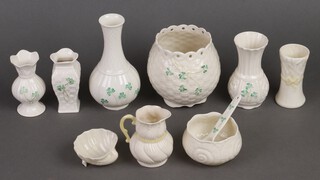 A Belleek circular vase 10cm, ditto vase 16cm, sugar bowl and spoon, jug 8cm and a vase 9cm, all with brown Belleek mark, a scallop shaped salt 8cm (green mark) and 3 Belleek vases (black marks) 