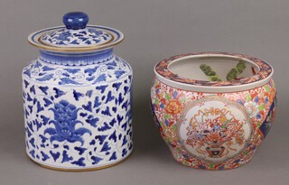 A reproduction Imari jardiniere 21cm and a blue and white jar and cover 29cm 