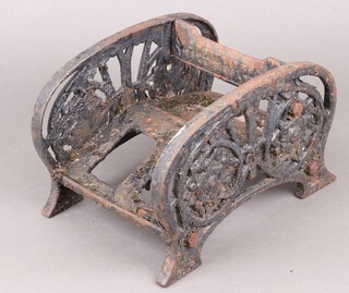 A Victorian pierced cast iron boot scraper 19cm x 30cm (1 blade missing)