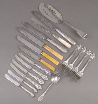 A Victorian pierced silver plated Old English fish slice, a Victorian ditto cake knife with mother of pearl handle and a small collection of plated flatware  