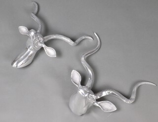 A pair of polished metal wall masks in the form of gazelles 46cm x 47cm 