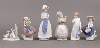 A Lladro figure of a standing girl with pot plant D-5, ditto girl with basket D-5M (both a/f) and 4 Nao figures