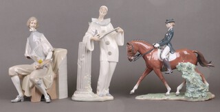 A Lladro figure of a dressage rider 31cm (horses ear a/f), 1 other of a seated artist (a/f) and a standing Pierrot (a/f) 