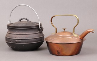 A copper kettle with brass handle together with an iron cooking pot marked Platpotjie 