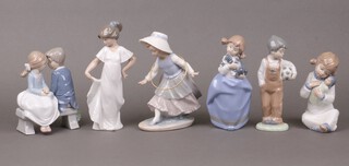 Six Nao figures - girl with hoop, girl with baby, girl with puppy, boy with football, standing girl and 2 seated children, all boxed 