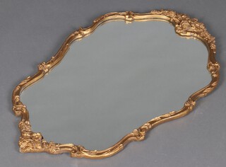 A shaped plate mirror contained in a gilt frame 73cm x 46cm 