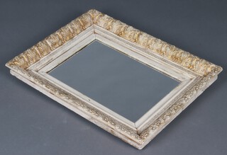 A rectangular plate mirror contained in a decorative gold and cream painted frame 59cm x 75cm 