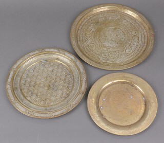 A Benares brass circular plate 20cm and 3 others 25cm and 29cm 