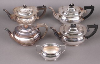 A Garrards Regent plate oval silver plated teapot, matching cream jug and 3 silver plated teapots