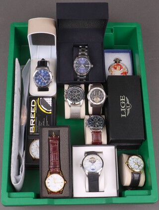 A collection of fashion wristwatches including a Heritor automatic wristwatch, 2 Lige watches, a Yazole, a Lorus chronograph, 2 So & Co (1 boxed), a Frederick Stein watch, a Geneva watch, a Strada pocket watch on chain, an Olevs watch, a Biden automatic watch, and aBreed watch