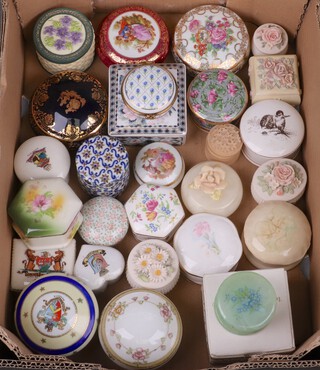 A collection of pottery trinket boxes 