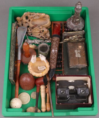 A carved serpentine model of a lighthouse 15cm, an Eastern wooden abacus and various curios 