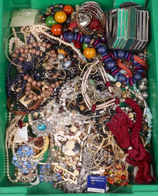 A quantity of costume jewellery including beads and a quantity of commemorative crowns 