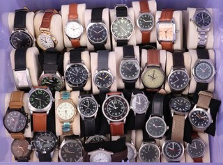 Approximately 57 gentleman's fashion wristwatches including Eaglemoss, Curren etc 