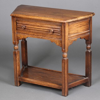 A reproduction oak side table fitted a frieze drawer with linen fold decoration, raised on turned supports with undertier, 71cm h x 79cm w x 36cm d (marks to top)