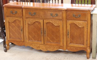 An American style oak breakfront sideboard fitted 1 long drawer above double cupboard, flanked by 2 short drawers above cupboards 82cm h x 153cm w x 43cm d 