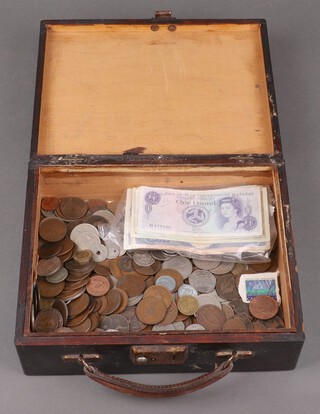 A collection of world coinage and bank notes contained in a small wooden box with hinged lid 
