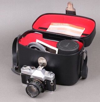 A Mamiya DSX 1000 SLR camera in a fitted case with accessories to include a 55mm lens, tube extension kit, a Takumar 137mm lens, a Vivitar 49mm wide angle lens, light meter filters, etc all contained in a fitted case  