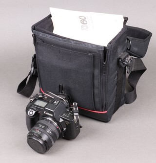 A Canon EOS RT SLR camera together with a 30-70mm lens, a 75-300mm lens, a Suntax flash together with a fitted case 