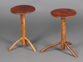 A pair of circular rustic elm wine tables on platform bases 45cm x 27cm diam.