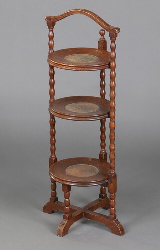 A 1930's circular 3 tier oak cake stand with spiral turned decoration 80cm h x 25cm diam. 