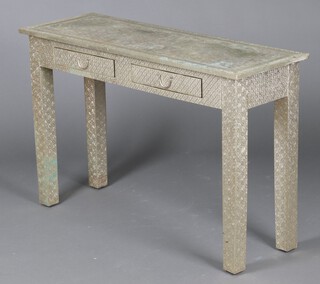 An Indian 20th Century rectangular embossed metal rectangular side table fitted 2 drawers, raised on square supports 75cm h x 115cm w x 40cm d 