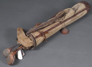A Hickory shafted golf driver and 4 other vintage golf clubs in a canvas bag 