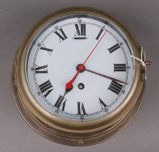 A ward room style clock with 17cm dial, Roman numerals, contained in a brass case 