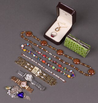 Three ladies fashion wristwatches, together with a collection of chains, pendants, charms, vintage and other costume jewellery 
