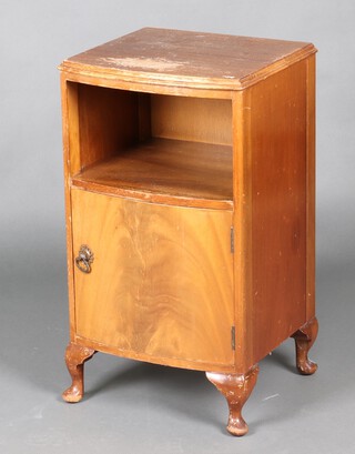 A walnut bow front bedside cabinet on cabriole supports 74cm h (water and contact marks in places)