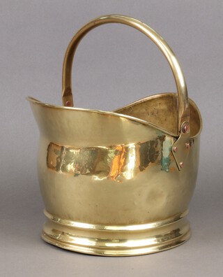 A brass helmet shaped coal scuttle 22cm 