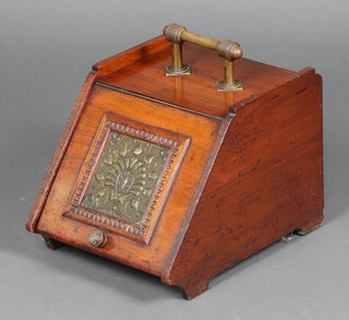 An Edwardian oak coal box with embossed brass panel to the front 30cm h x 34cm w x 44cm (no shovel) 