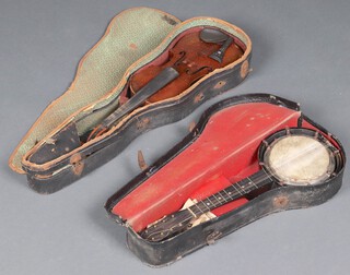 A violin and case together with an 8 stringed banjo  cased 