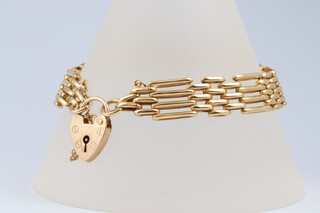 A 9ct yellow gold gate link bracelet with a 9ct heart shaped padlock clasp, 18cm, 15.4 grams 