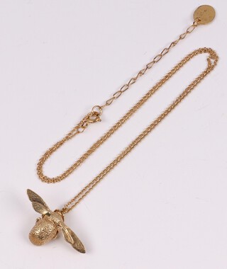 An Alex Monroe silver gilt bumblebee pendant hung on a silver gilt chain