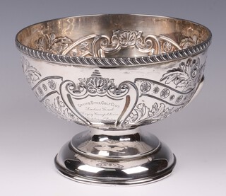 A circular embossed silver bowl raised on a plain spreading foot, with presentation inscription, Birmingham 1904 by Thomas Wooley, 398 grams 