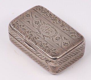 A George III silver vinaigrette with engraved decoration and parcel gilt interior, the lid with monogram, London 1807 by William Hall 