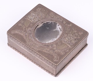 A 19th Century Continental engraved silver box, the hinged lid embossed cornucopias and with glass panel to the centre, 3.5cm x 8cm x 6cm, 128 grams gross  