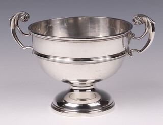 A silver twin handled trophy cup London 1912, marks rubbed, 428 grams 