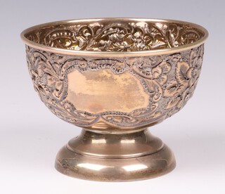 A Victorian circular embossed silver sugar bowl Birmingham 1899 by William Davenport, 163 grams 