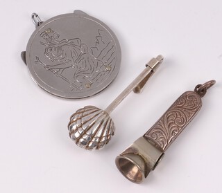 A silver napkin clamp in the form of a scallop shell, a Sterling silver cigar cutter together with a circular stainless pocket knife with blade and nail fail the centre carved St Christopher