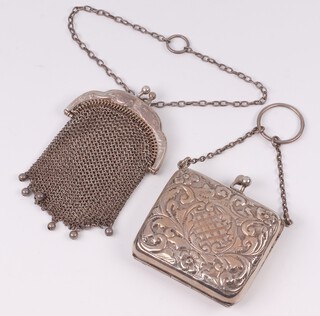 An Edwardian embossed silver purse with fitted cloth interior, Birmingham 1908, makers marks rubbed, together with a mesh purse 