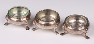 Three Georgian silver salts (marks rubbed) with associated glass liners, 111 grams 