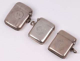 An Edwardian engraved silver vesta case Birmingham 1876, by Deakin Francis Ltd. with inscription, a monogrammed vesta case Birmingham 1906 by William Naul,  and 1 other 1918 by Joseph Gloster, 92 grams 