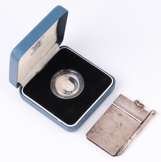 A plain silver aide memoire with propelling pencil, Birmingham 1912 by S Blanckensee & Sons Ltd., 25 grams including pencil and lead, together with a 1988 proof 1 pound coin 