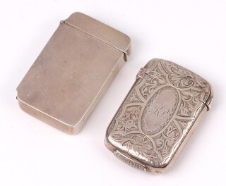 A Victorian engraved silver vesta case Birmingham 1978 (some dents) together with a plain silver vesta case marked Silver, 45 grams  