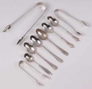 A pair of George III silver sugar tongs London 1791, 2 other pairs of silver sugar tongs and 5 various tea spoons and a coffee spoon, 164 grams 