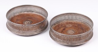 A pair of pierced circular silver bottle coasters London 1986 by John Bull Ltd., 12cm 