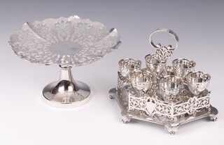 A pierced silver plated 6 piece egg cruet 19cm together with a circular pierced plated pedestal tazza 22cm 